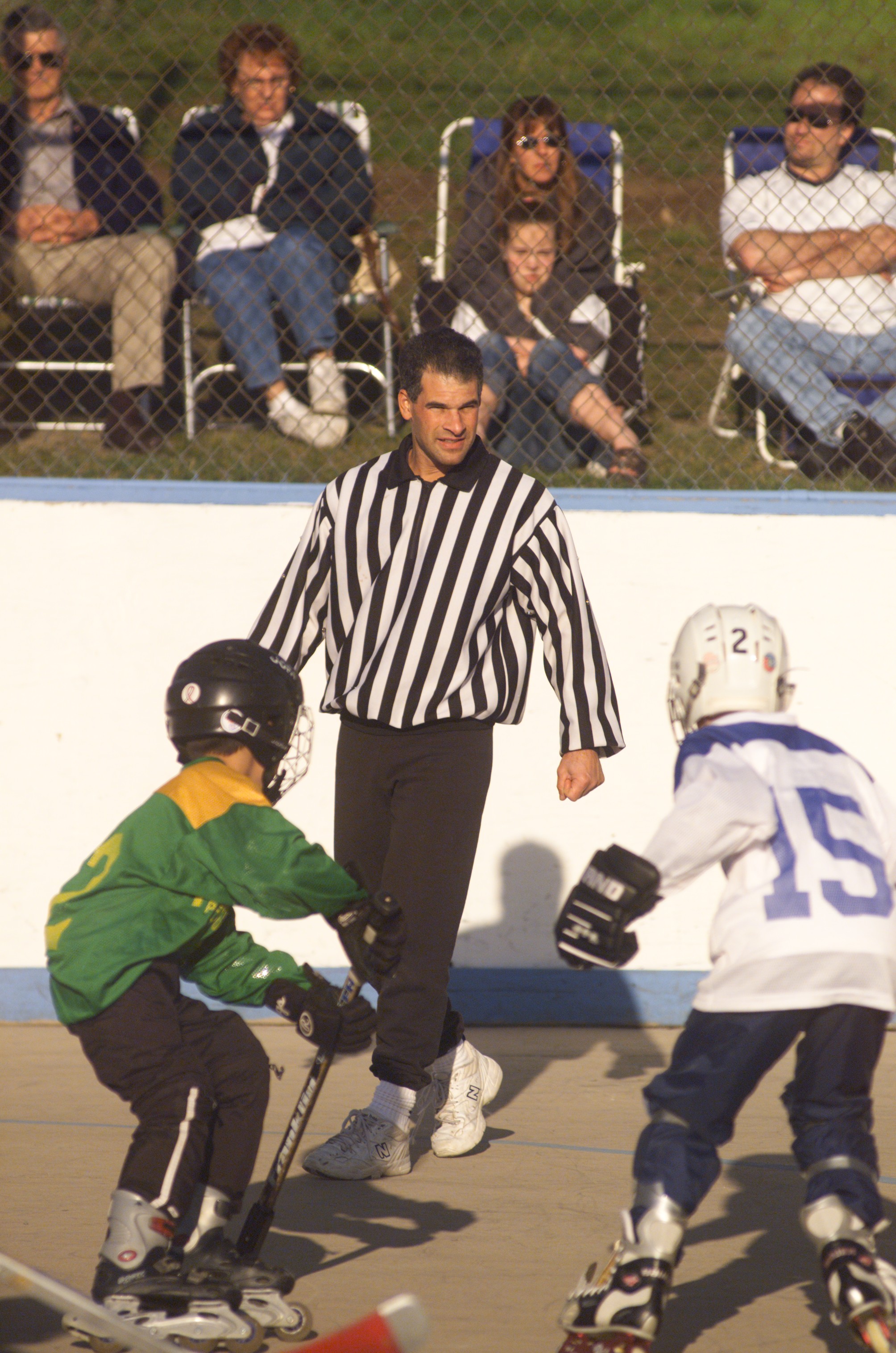 Bob Cushman officiating a youth street hockey game